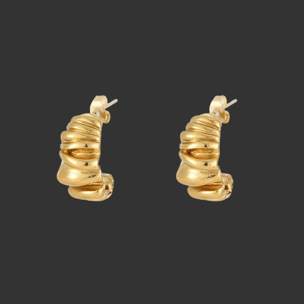 gold c shape stud earrings on a black background
