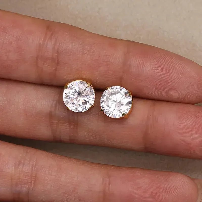 18k gold plated stud earrings with clear round stones held on fingers by metal content