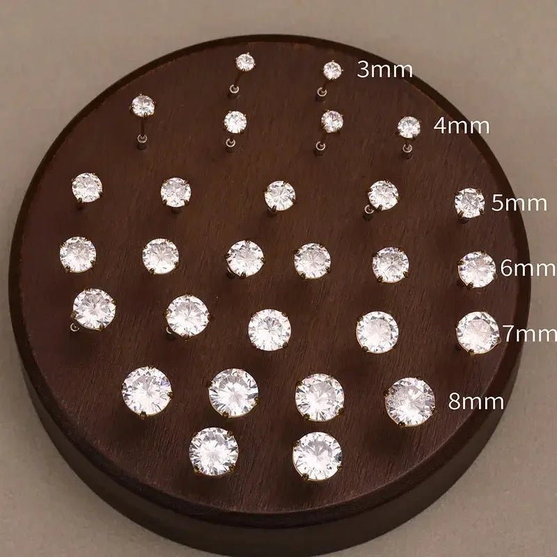 Set of 18k gold plated stud earrings in sizes 3mm to 8mm displayed on wooden holder
