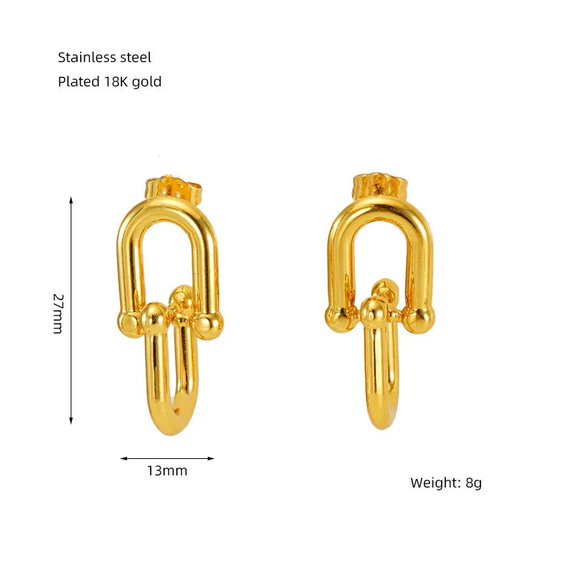 Gold horseshoe buckle earrings with measurements and material details on a white background