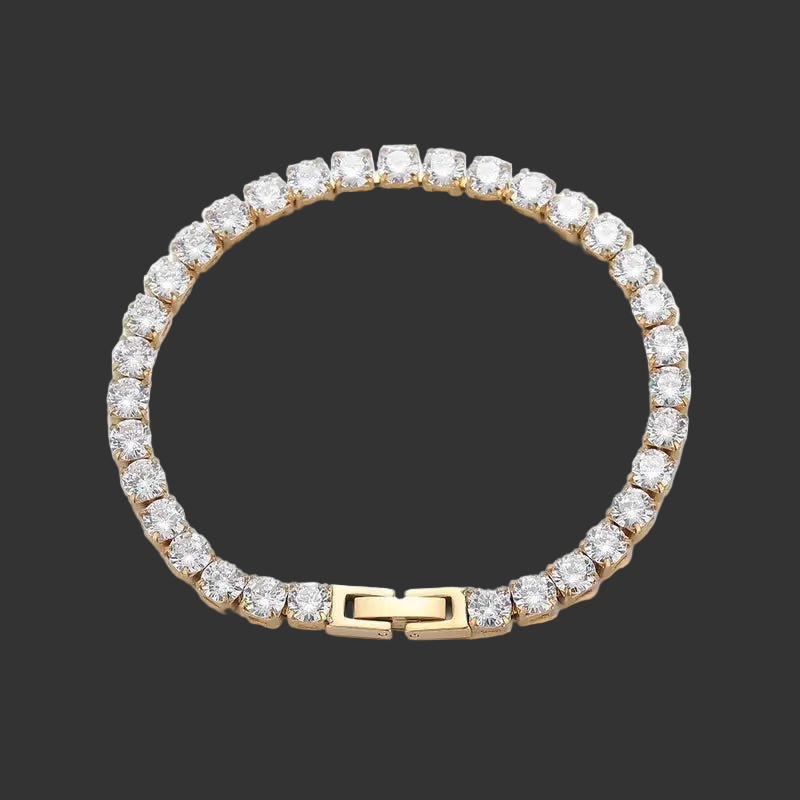 Gold bracelet with clear gemstones on a black background