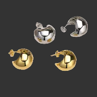 Set of gold and silver hoop earrings on a black background