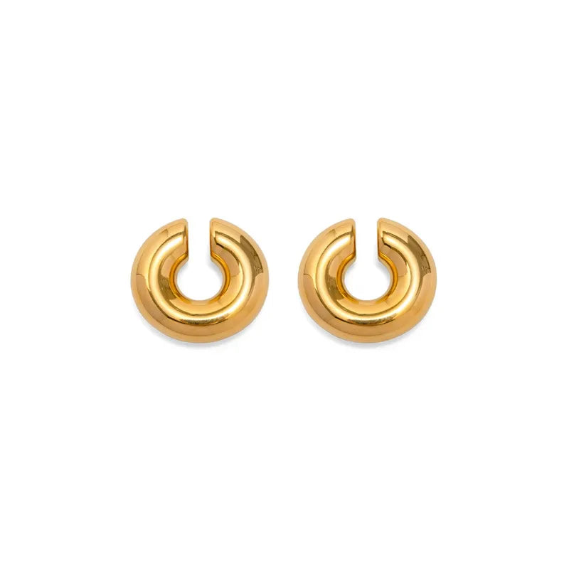 Pair of gold large chunky ear cuffs on a white background