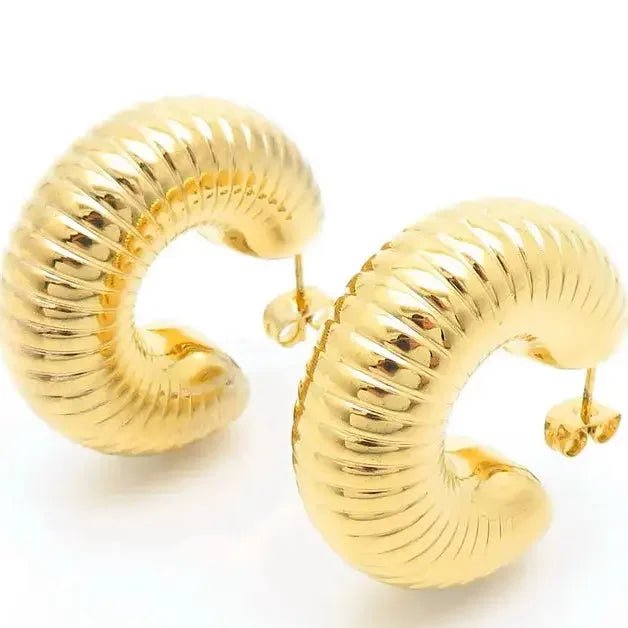 18k gold chunky hoop earrings with ribbed texture and polished finish by metal content