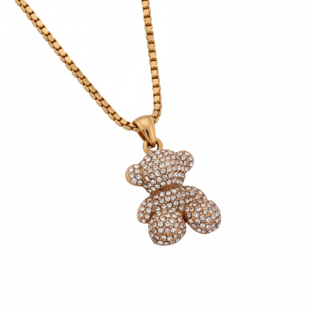 Gold sitting teddy bear with inlay stones pendant necklace on a white background