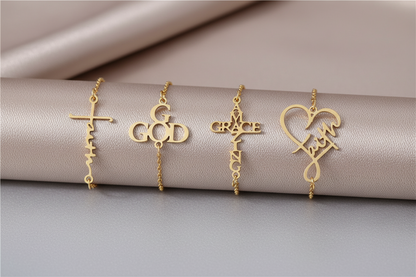 Gold bracelets with religious symbols on a beige fabric background