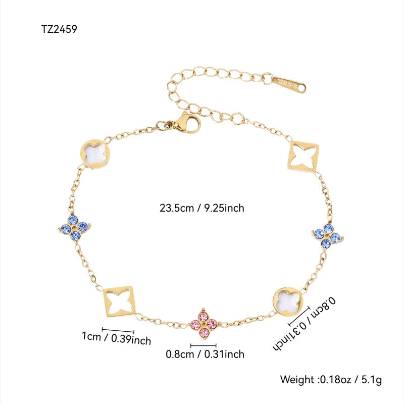 Gold bracelet with four leaf clover and star-shaped links with measurements on a white background