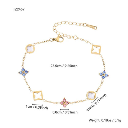 Gold bracelet with four leaf clover and star-shaped links with measurements on a white background