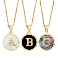 Three gold necklaces with round pendants labeled A, B, and C on a white background.