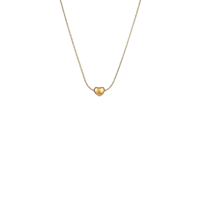 Gold heart-shaped pendant on a thin chain against a white background
