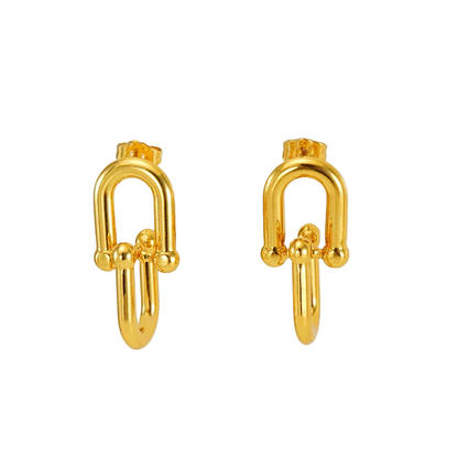 Pair of horseshoe buckle earrings on a white background