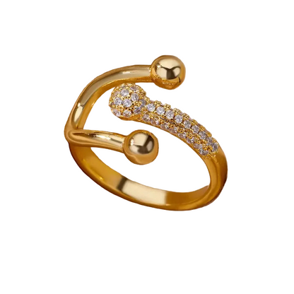 Gold 3 prong open ring with stone accents on a white background