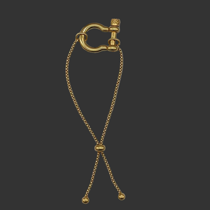 Gold horseshoe lock bracelet on a black background
