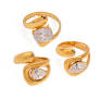 3 gold rings with clear marquis gemstones on a white background