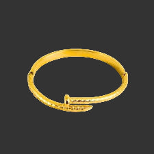 Gold nail bracelet on a black background