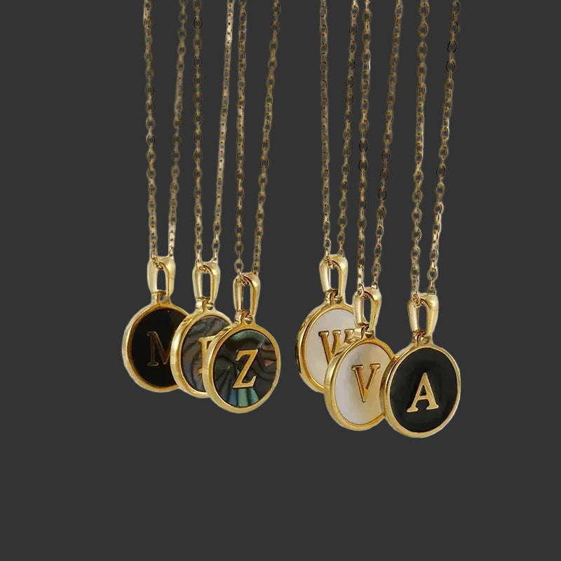 Multiple initial Pendant Necklaces Men's and Women's 18K Gold Plated Stainless Steel on black background