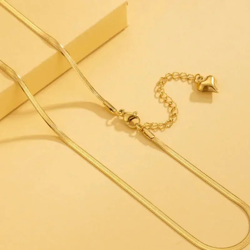 Men's gold plated necklace with adjustable chain and heart charm clasp by metal content