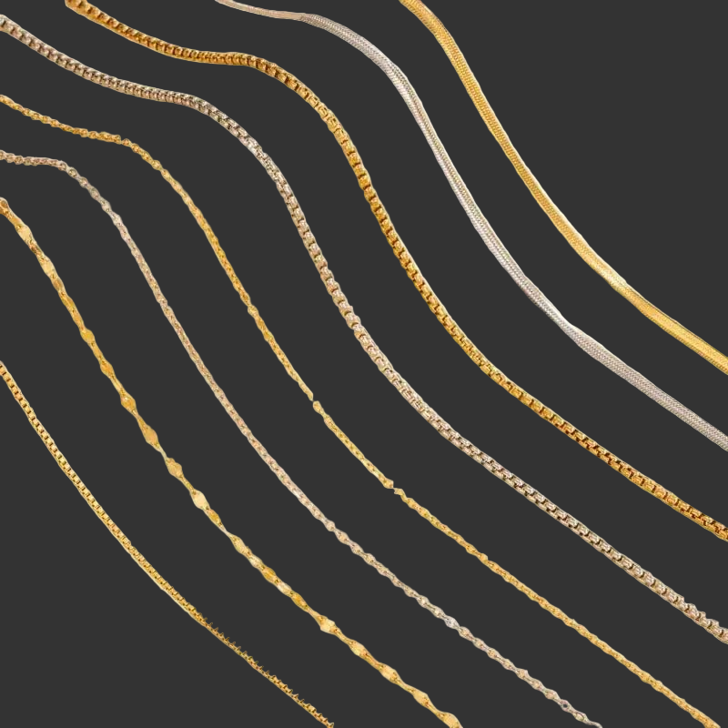 Gold and silver chain necklaces on a dark background