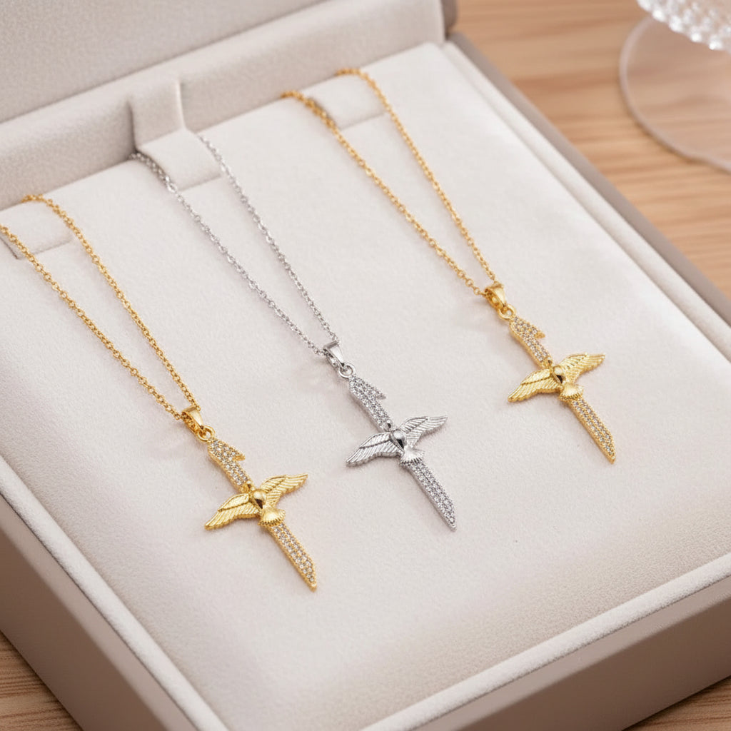 dove cross necklaces in gold, silver and mixed metal on beige jewelry box