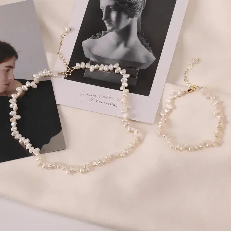 Women's pearl necklace and matching bracelet with irregular pearls on gold chain by metal content