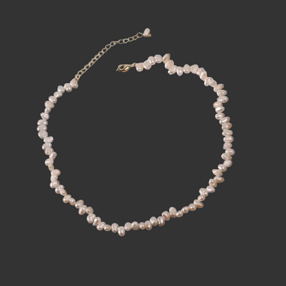 Pearl necklace on a black background